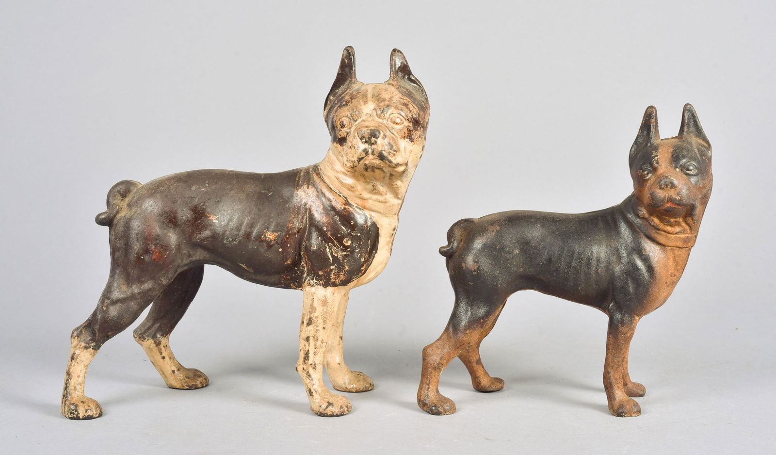 (2) Cast Iron Boston Terrier Doorstops: (2) Cast iron Boston Terrier doorstops, Hubley 9-1/2" L x 10" H and similarly designed, 8" L x 8-1/2" H