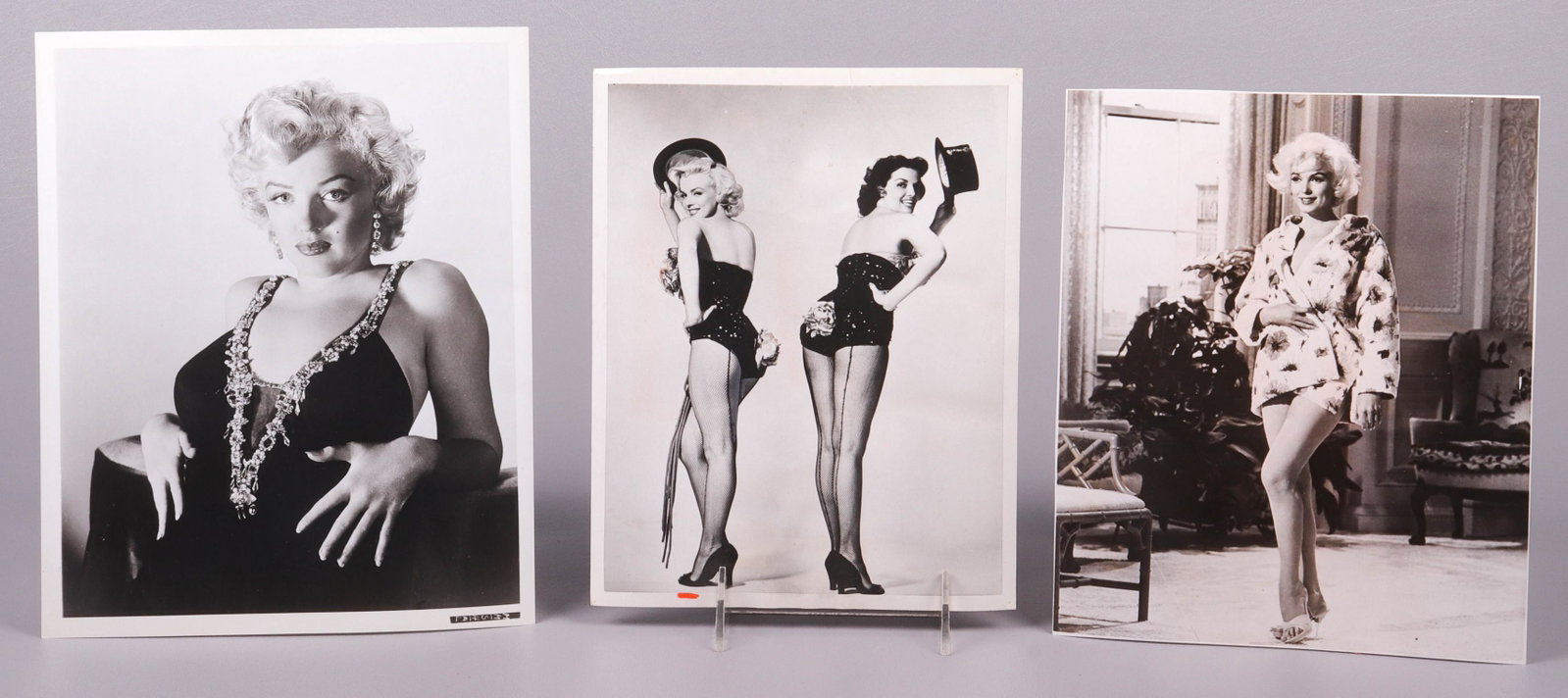 (3) Black and White Marilyn Monroe Photos: (3) Black and white Marilyn Monroe photos to include photo of Monroe with Jane Russell in 'Gentlemen Prefer Blondes', originally dated 4/26/53 but stamped published March 1969, minor flaws on edges, c