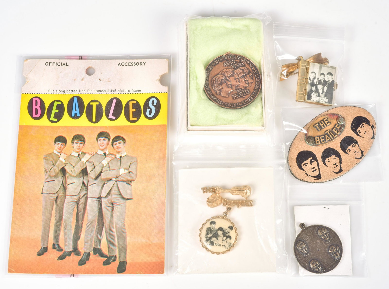 (5) Pcs Beatles Jewelry: (5) Pcs Beatles jewelry, c/o 1966 Beatles medallion manufactured in Germany by Davo Distribution to commemorate the groupÃ¯Â¿½s Blitztournee tour in original box, charm with portraits in re