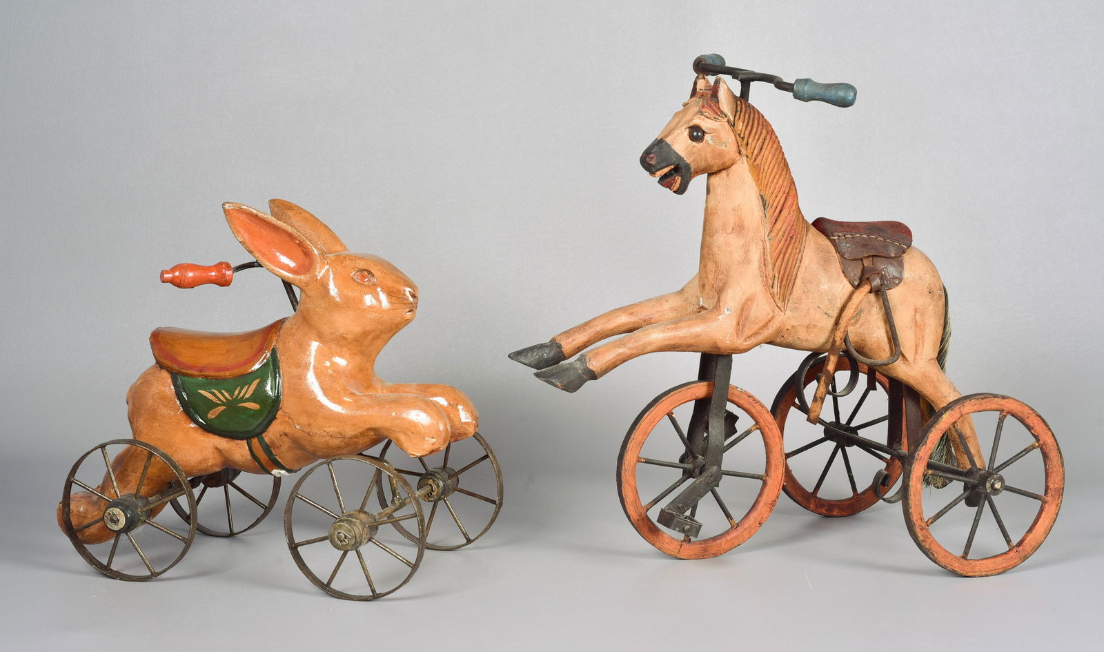 (2) Folk Painted Animal Toys: (2) Folk painted animal toys to include wheeled rabbit toy and carved wood wheeled pony toy, modern, 10-1/2" H and 14-1/2" H