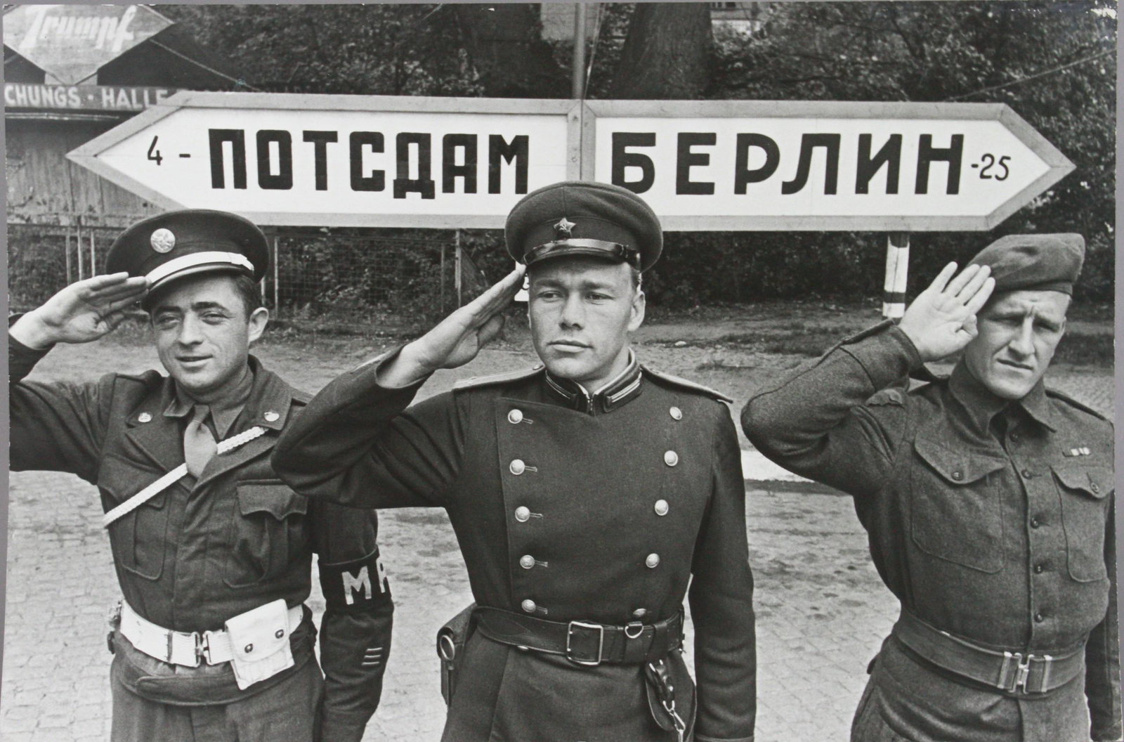 Samariy Gurariy, MPs at Potsdam Berlin Checkpoint: Samariy Gurariy (Russian, 1916-1998), MPs at Potsdam Berlin Checkpoint, gelatin silver print, date of printing unknown, 15" x 22-5/8", good condition, wear at corners, (note the sign in the upper left