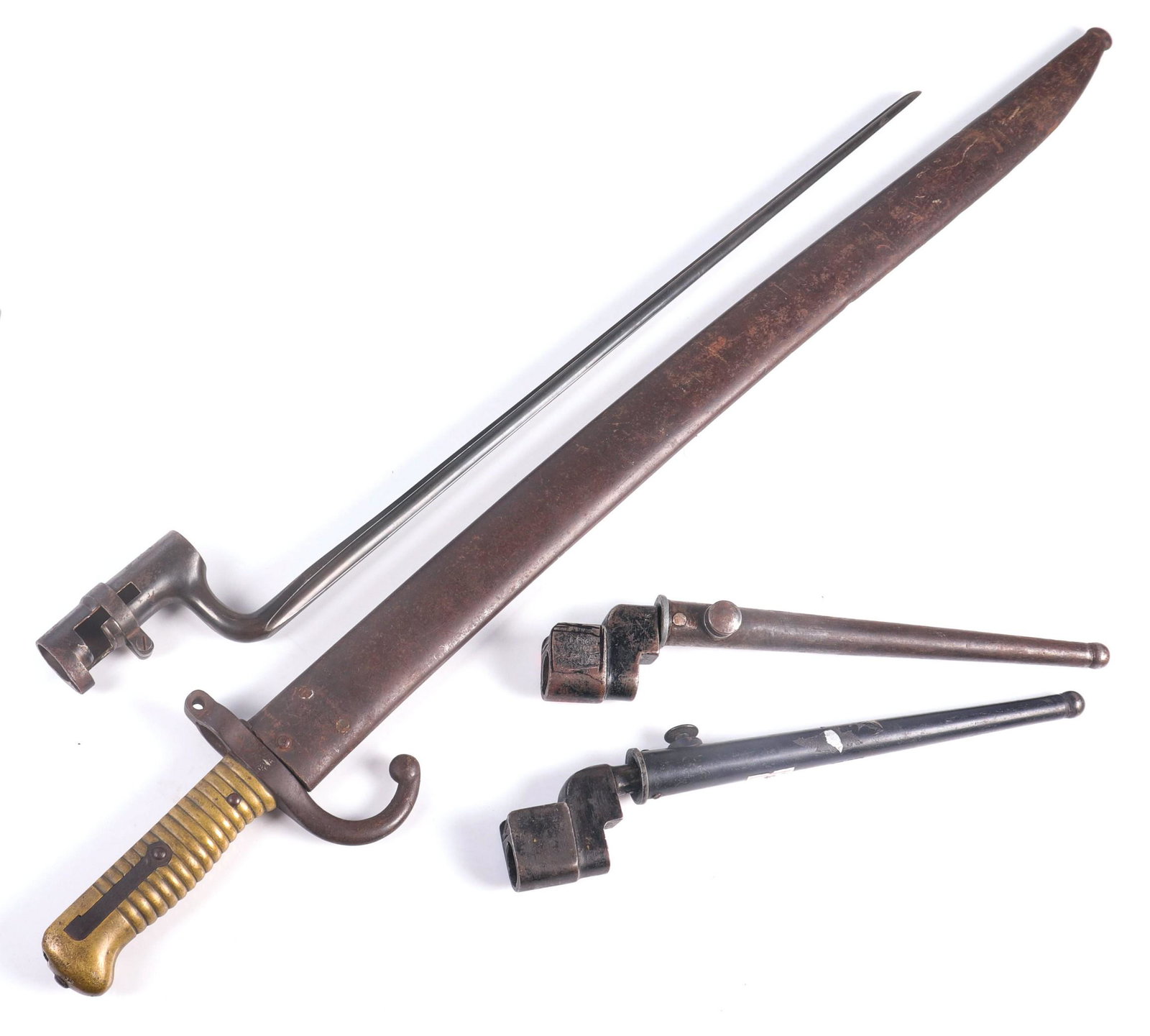 (4) Bayonets: (4) Bayonets, US Springfield 45-70, 1874 French St Etienne Guillet w/scabbard, made for Model 1874 "Gras" Infantry Rifle; (2) Enfield No.4 MKII Spike Bayonets w/scabbards