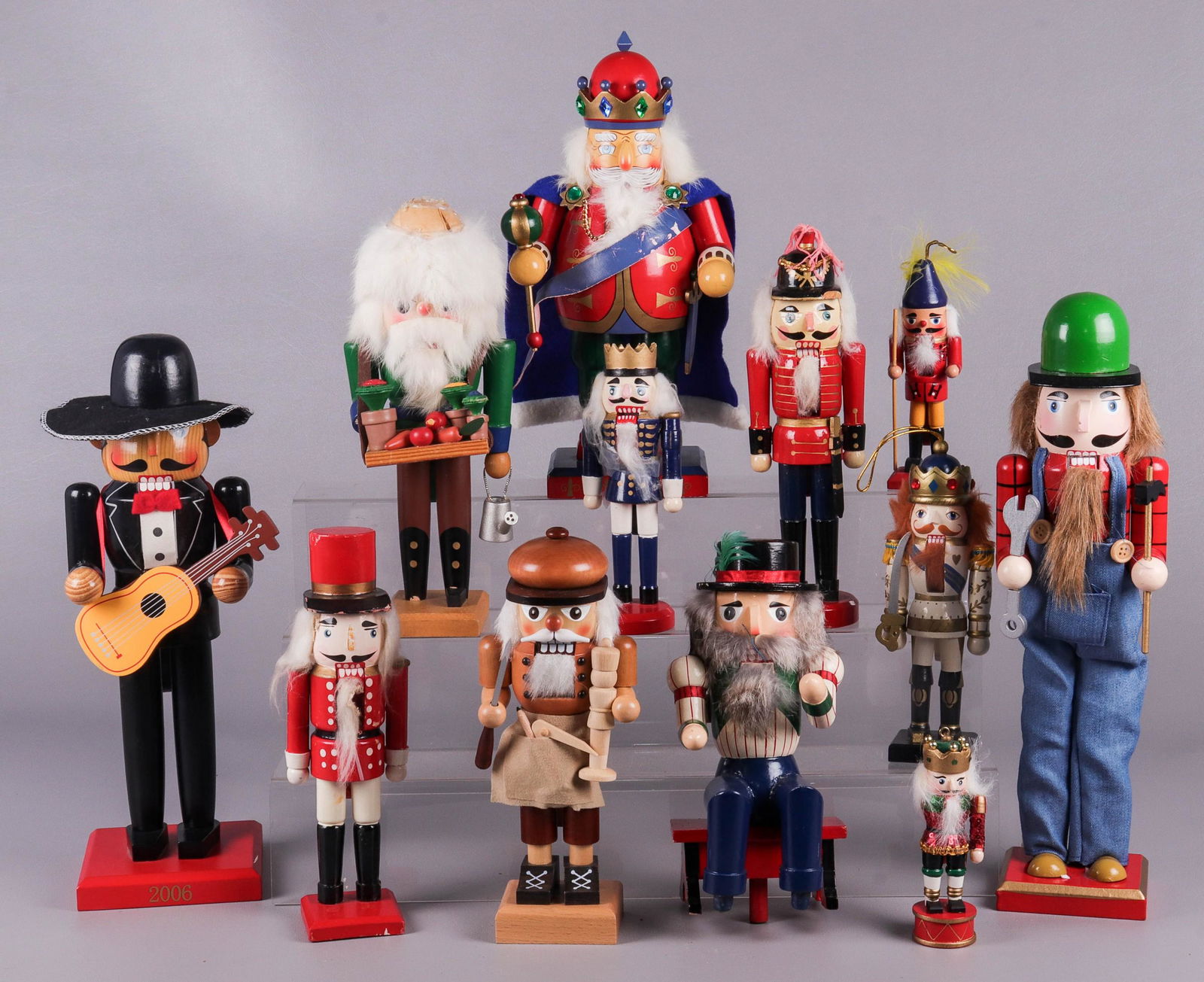 (12) Christmas Nutcrackers: (12) Christmas nutcrackers, including Mexican guitarist Limited Edition 386/7509, Crate & Barrel Ulbricht Germany carpenter, Nutcracker village gardener (missing hat), Nutcracker Village Old World Jol