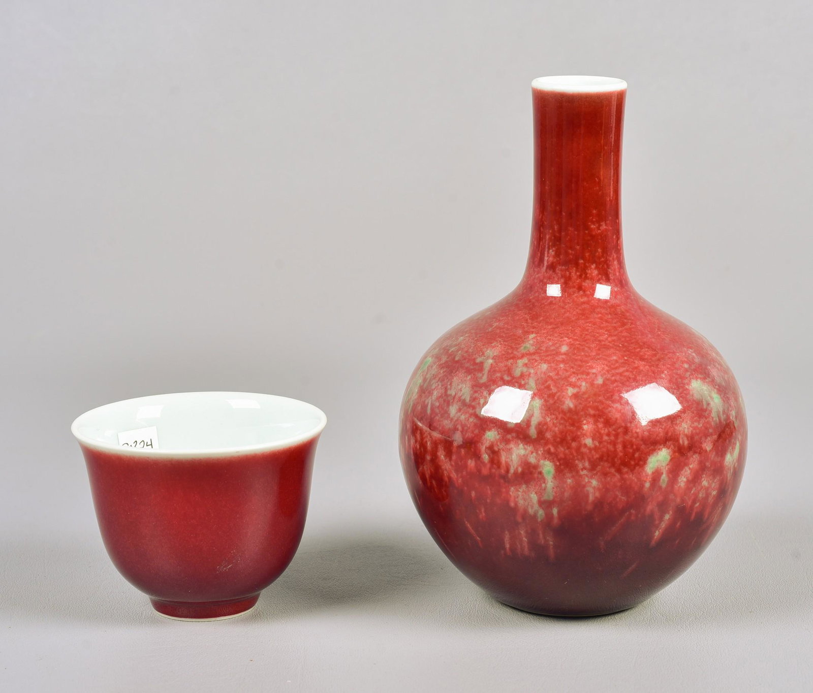 (2) Chinese Porcelain Pieces: (2) Chinese porcelain pieces, 6-character marks to base, c/o sang de boeuf cup, flambe stick vase, tallest 7-1/2"