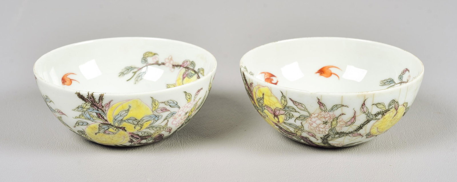 Pair of Chinese Porcelain Bowls: Pair of Chinese porcelain bowls, peach & bat decoration, 4-character mark to base, 3-1/2" dia x 1-1/2" h, one with small chip & hairlines