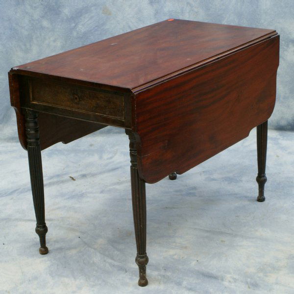 Mahogany Sheraton drop leaf table with reeded legs: Mahogany Sheraton drop leaf table with reeded legs, shaped leaves, drawer in one end, 20" w x 38" l x 13 leaf