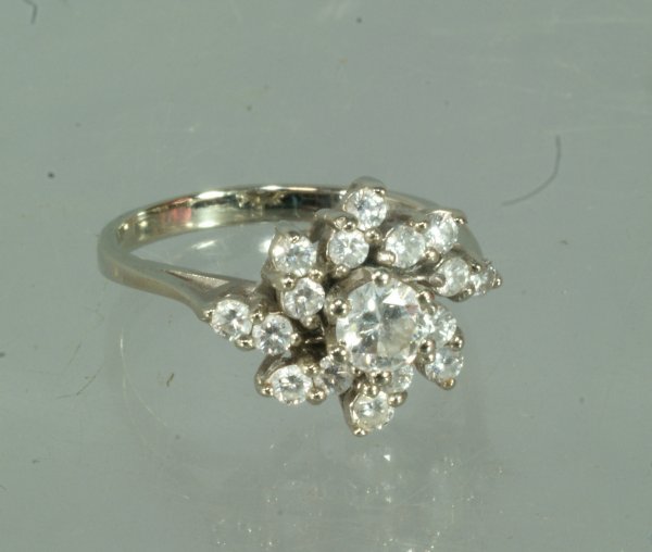 14K WG ladies cocktail ring with center stone appro: 14K WG ladies cocktail ring with center stone approximately 20-30 pts surrounded by 16 small diamonds approximately 2-3 pts each, size 7 3/4