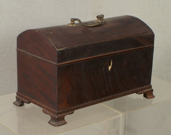 Dome top herringbone inlaid 3-compartment tea caddy: Dome top herringbone inlaid 3-compartment tea caddy on original OG feet with a teardrop shaped ivory escutcheon (damaged), 9 1/4" w, 6" h, 4 7/8" d, minor losses to herringbone inlay on top