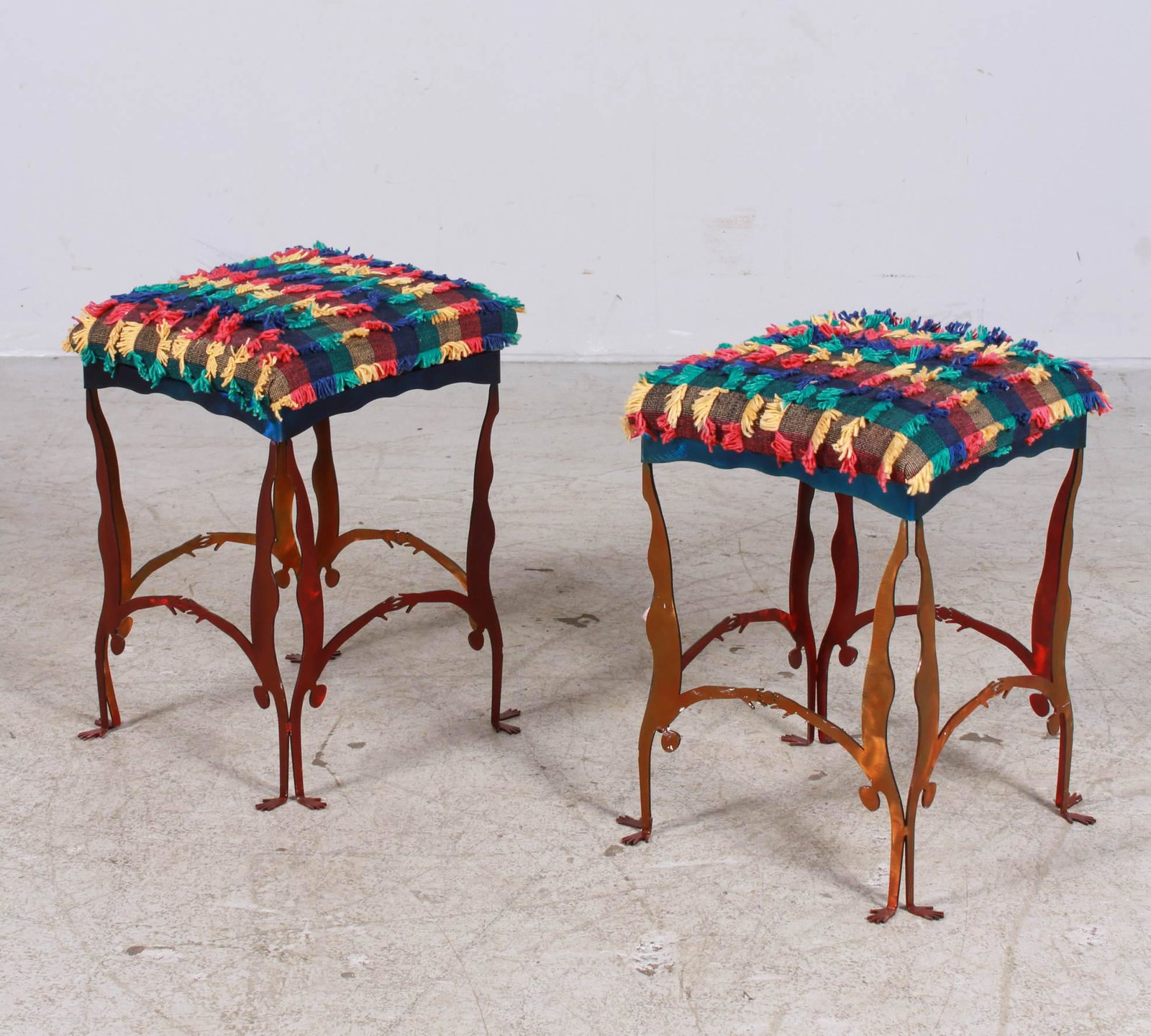 Pair figural metal footstools: Pair figural metal footstools, upholstered seats, colored metal figural base, 17"h x 14"square