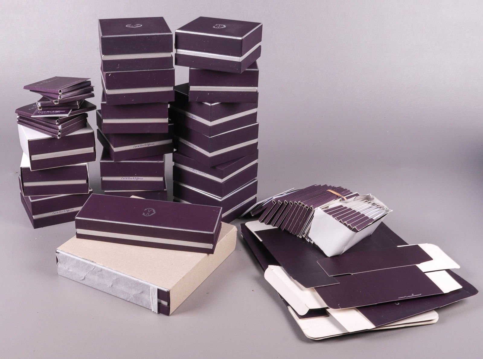 Charriol Geneve Boxes and Salesperson Items: Charriol Geneve boxes and salesperson items to include (16) boxes, (20)+ warranty cards and informational pamphlets and assorted cardboard boxes.