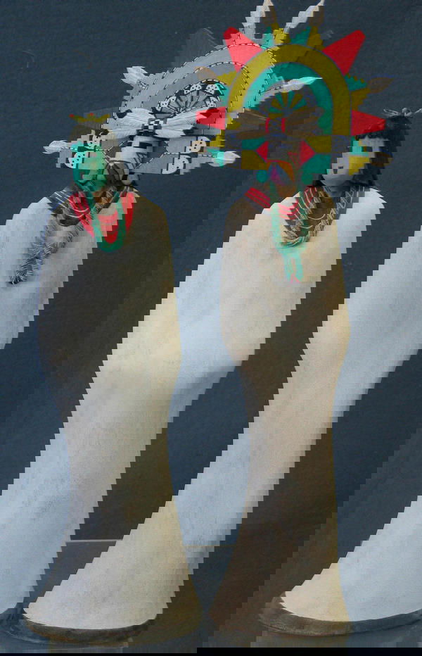 A Pair of Hopi Butterfly Kachinas by Michael Dea: A Pair of Hopi Butterfly Kachinas by Michael Dean Jenkins; Male H17" W 3 .5" Female 14.5" W 5 " Each hand carved with undulating white bodies, painted red neck bands with twisted turquoise necklaces;