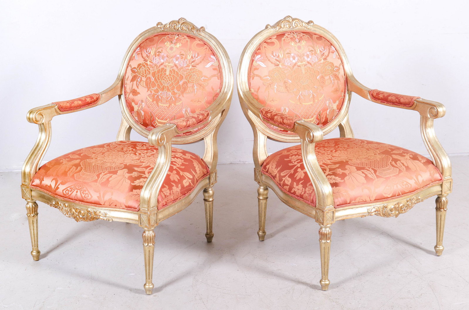 Pr Louis XVI Style Fauteuils: Pr Louis XVI Style Fauteuils, pale cranberry upholstery with overall floral pattern, gilt finish, exc condition, unmarked, 37 1/2" h, 26" w