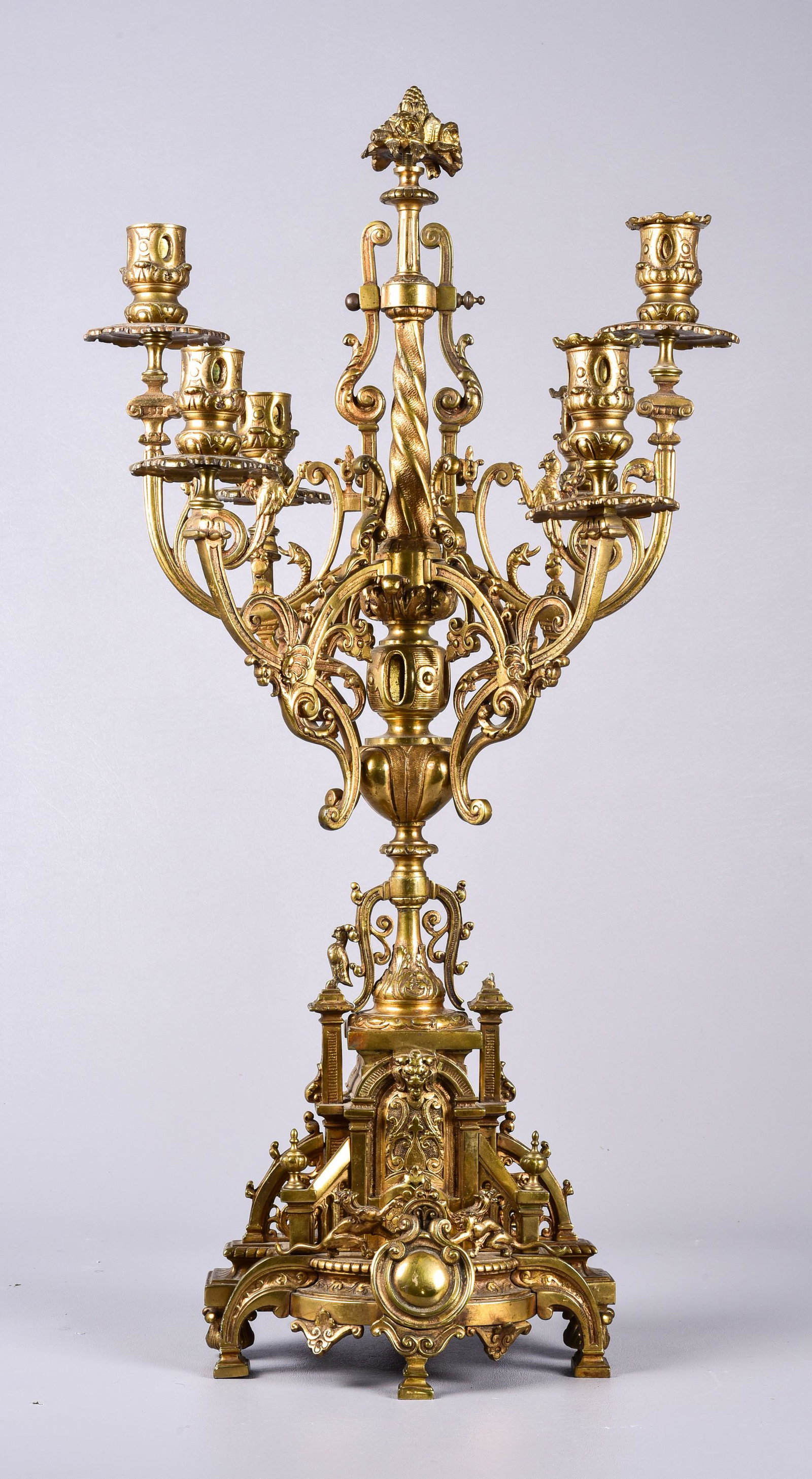 Large Gilt Bronze Candelabra: Large gilt bronze candelabra, 6 candle sockets, rampant lions on base, exotic birds & snakes on arms, fruit cluster finial, 26" h, missing bird on base