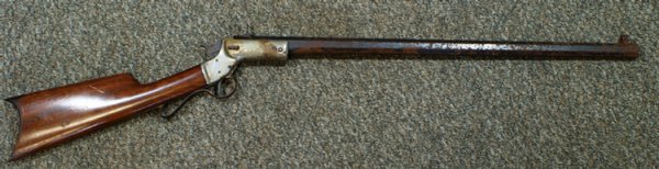J Stevens & Co Tip Up Rifle model 1 without foren: J Stevens & Co Tip Up Rifle model 1 without forend, 26" barrel, SN 22425, rust & pitting on octagon barrel and nickel plated frame, Patent September 6, 1884