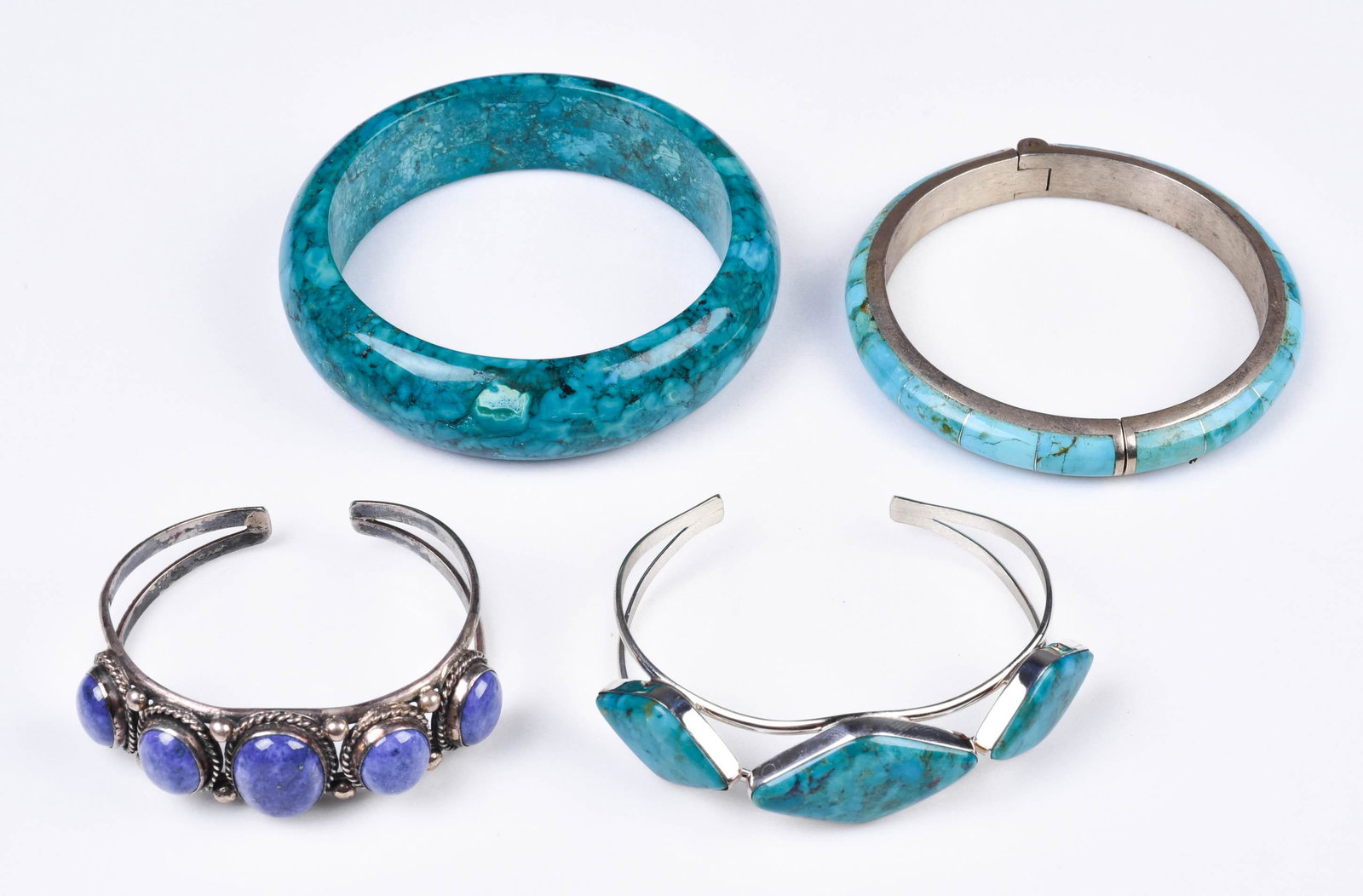 (4) Pc Bangle and Cuff Bracelets: (4) Pc Bangle and cuff bracelets, (1) stone bangle, (1) inlay turquoise spring loaded bracelet, (1) Lapis cuff bracelet and (1) Turquoise cuff bracelet.
