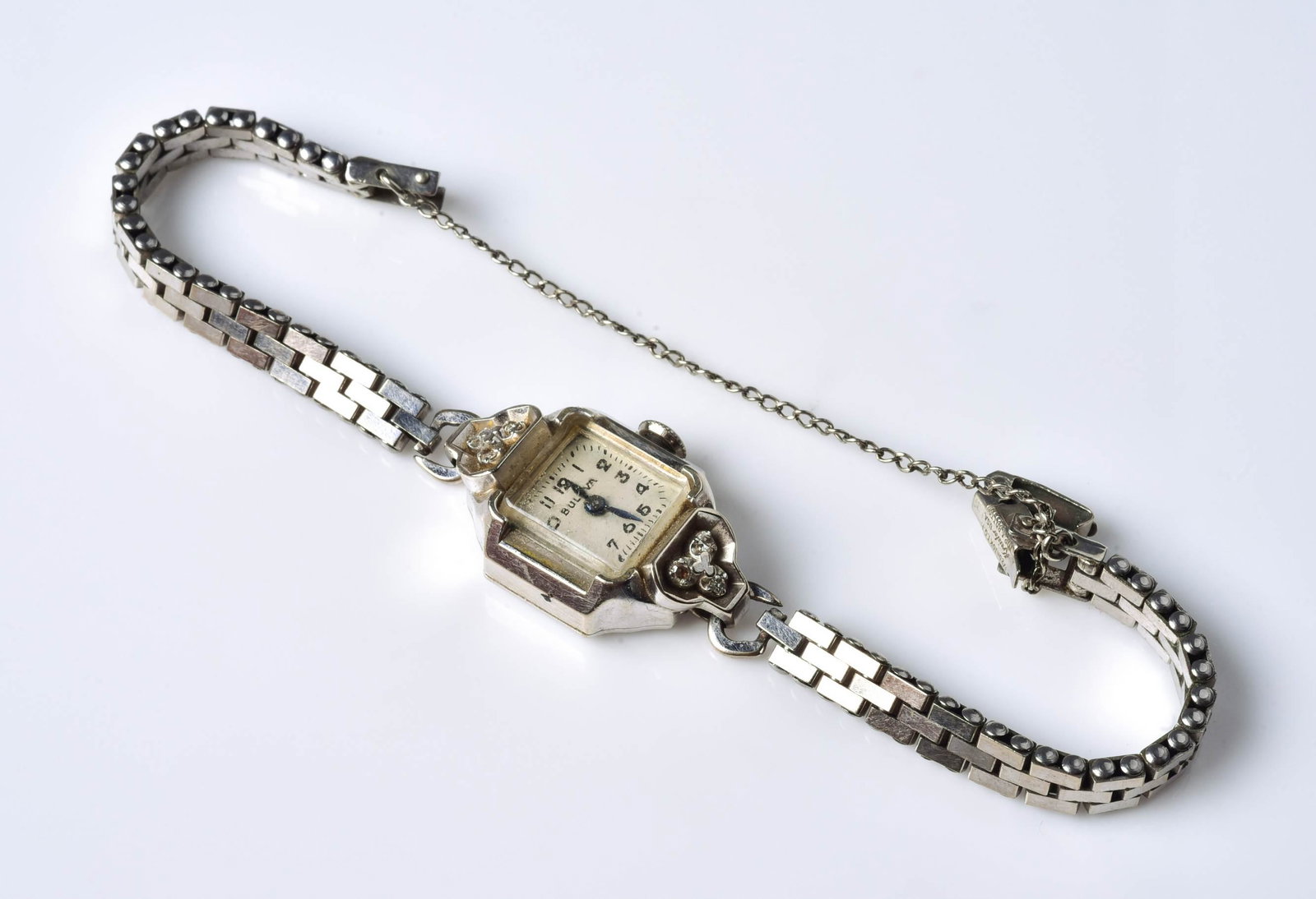 14K WG Ladies Bulova Watch Vintage: 14K WG ladies Bulova watch, vintage, gold fillled case, with 6 accent diamonds, runs when wound however, we do not offer guarantees.