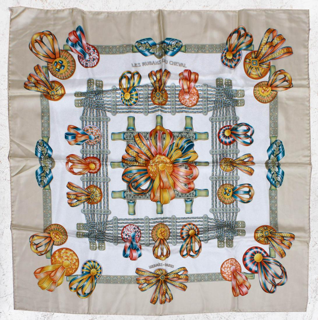 Hermes Le Rubans Du Cheval Silk Scarf: Hermes Le Rubans Du Cheval silk scarf, designed by Joachim Metz, in cream, blue and clementine colorway, small 1/4" scuff to cream border, few spots of light discoloration, almost indetectable, 35" x 