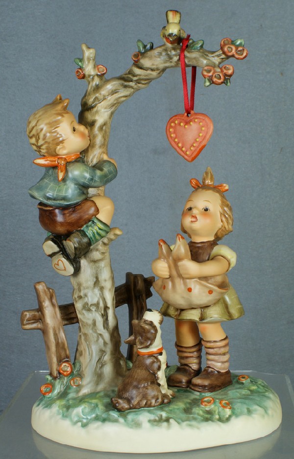 Hummel figurine: Here's My Heart - 766, 11" tall; m: Hummel figurine: Here's My Heart - 766, 11" tall; modern mark, no damage, original box, 4 digit security number etched on base