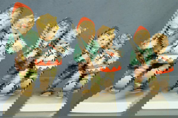 3 Hummel figurines: Volunteers - 50/I, 7" tall; Vol: 3 Hummel figurines: Volunteers - 50/I, 7" tall; Volunteers - 50/0, 5 1/2" tall; Volunteers - 50 2/0, 5" tall, modern marks, no damage,no boxes, 4 digit security number etched on base