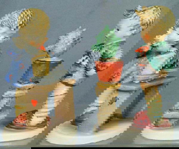 2 Hummel figurines: Confidentiality - 314, 1972, 6": 2 Hummel figurines: Confidentiality - 314, 1972, 6" tall; A Fair Measure- 345, 1972, 6" tall, modern marks, no damage,no boxes, 4 digit security number etched on base