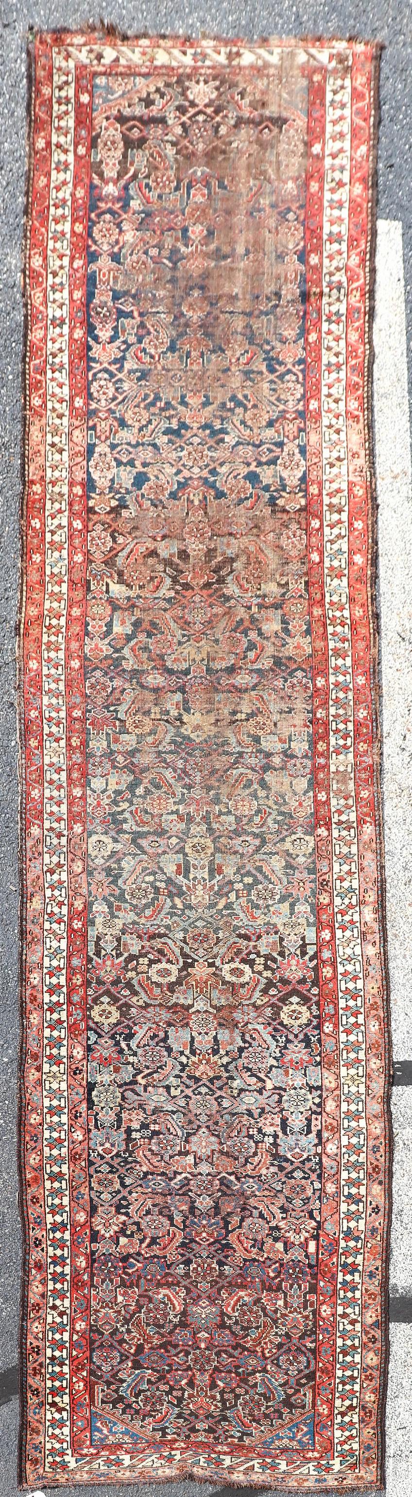 3'6" X 15' Antique Persian Shiraz Runner Rug: 3'6" X 15' Antique Persian Shiraz Runner Rug, circa 1920's; remediated end loss, hole, and all-over wear, see photos for specific condition concerns.