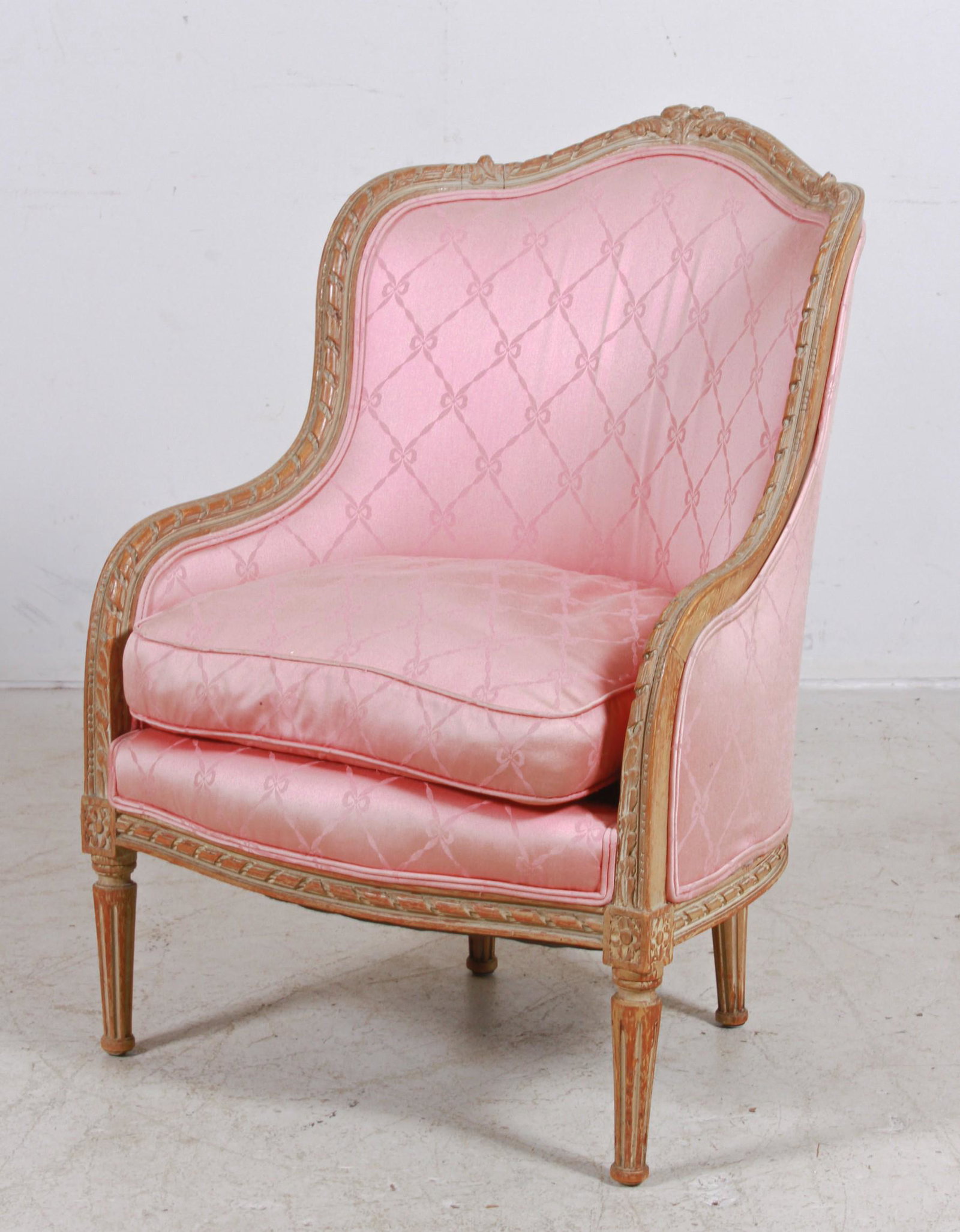 Louis XVI style carved slipper chair: Louis XVI style carved slipper chair, pink bow decorated upholstery, distressed gray painted frame, 36"h x 25"w x 24"d