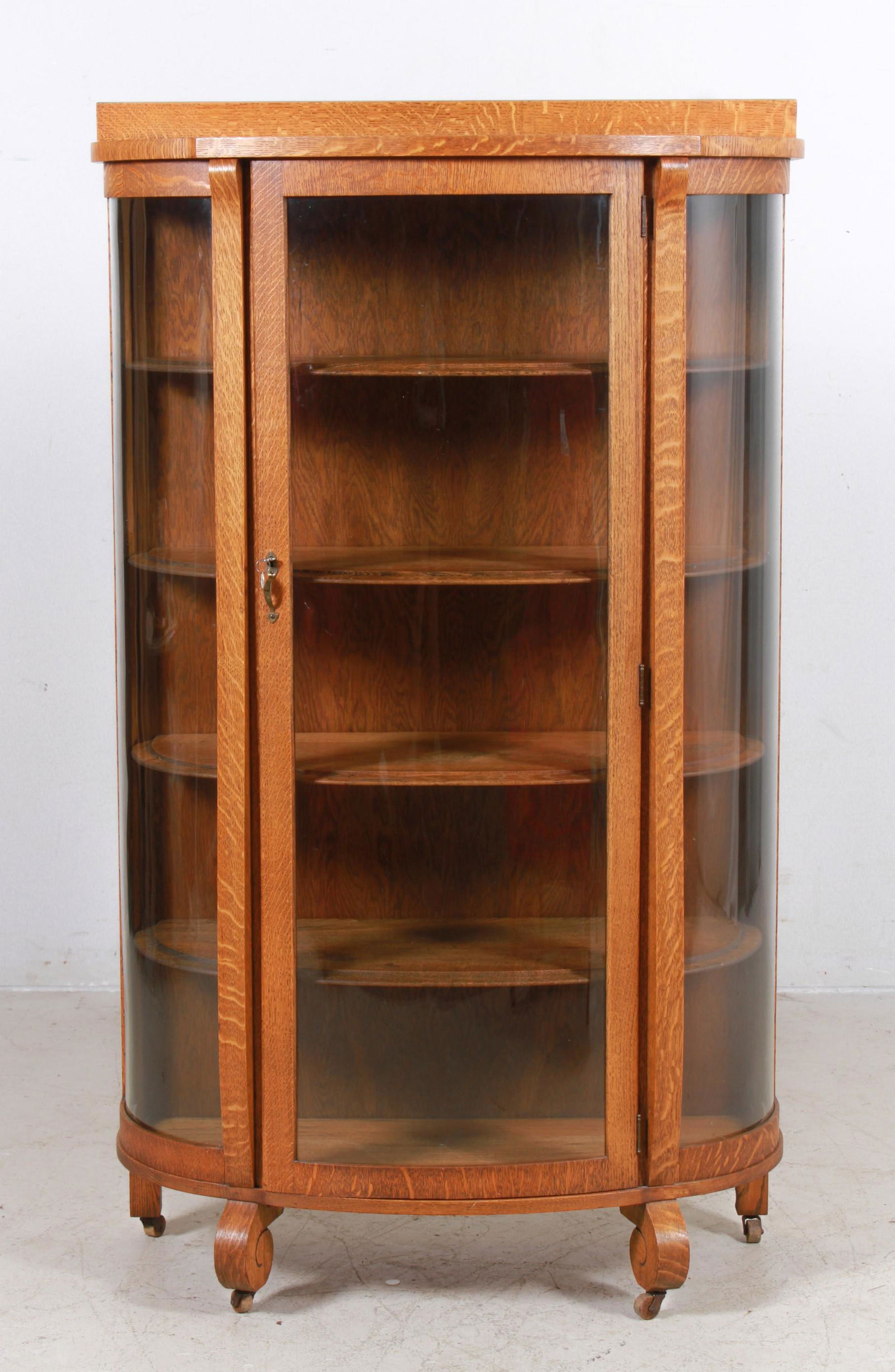 Oak bowfront display cabinet (1 of 3)