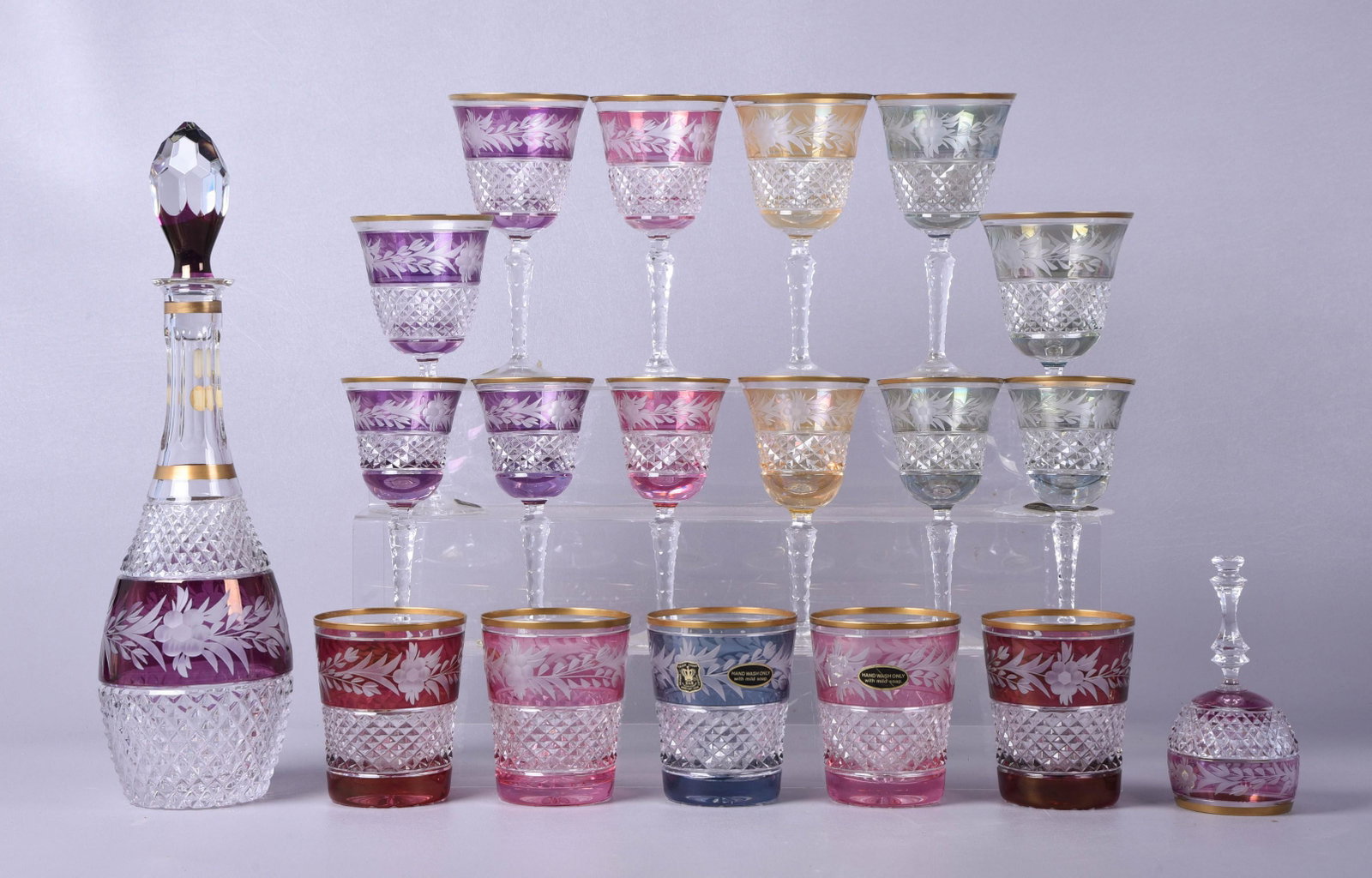 (19) Pcs Golden Crown E&R Cut Crystal: (19) Pcs Golden crown E&R Western Germany hand cut leaded crystal, various colors cut to clear, c/o 15" decanter, (5) 4" rocks glasses, (6) 7-1/2" red wine stems, (6) 6-1/4" white wine stems, bell (cl