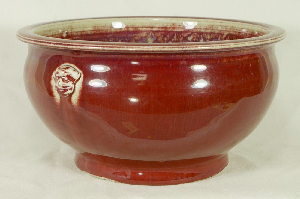 Chinese Sang De Boeuf bowl with lion handles, 10 1: Chinese Sang De Boeuf bowl with lion handles, 10 1/2" dia, kiln chipping to base, 19th c or earlier