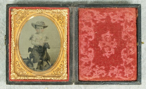 Dageurrotype of a young boy on a rocking horse to: Daguerrotype of a young boy on a rocking horse toy, leather case, 2 3/4" x 2 1/2"