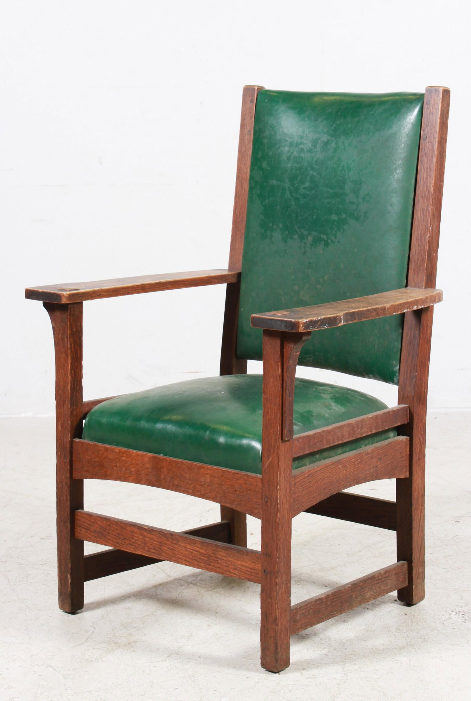 L & JG Stickley Mission oak lounge chair: L & JG Stickley Mission oak lounge chair, green leather upholstery, 41"h x 28"w x 22"d, wear to finish, moulding to upholstery