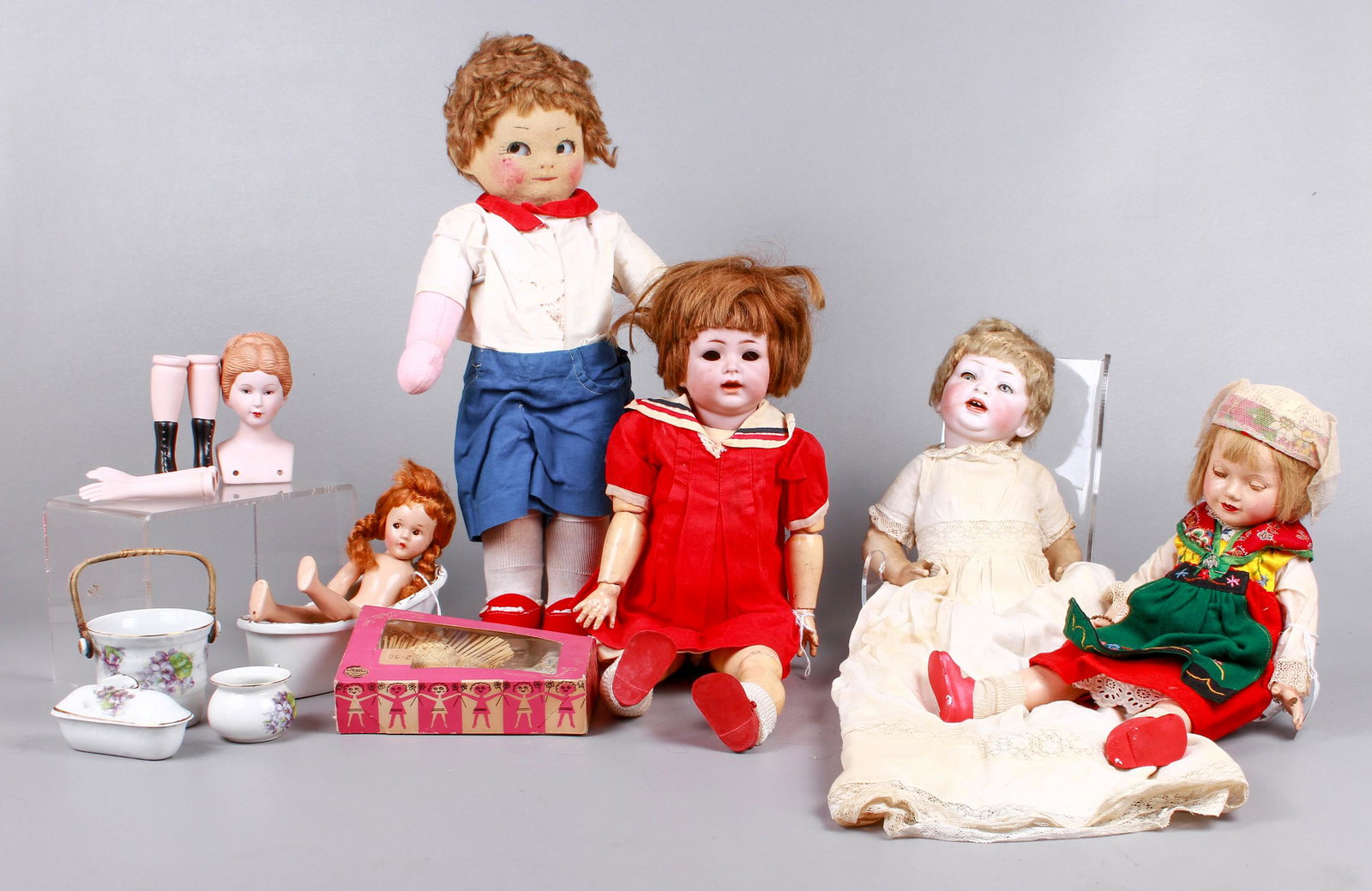Doll and Accessories Grouping: Doll and accessories grouping to include 4-piece miniature wash set, Ginny Fashion hat and dress in box, Effanbee Anne Shirley doll with damage, missing fingers, eyes stuck in half open position, 1980