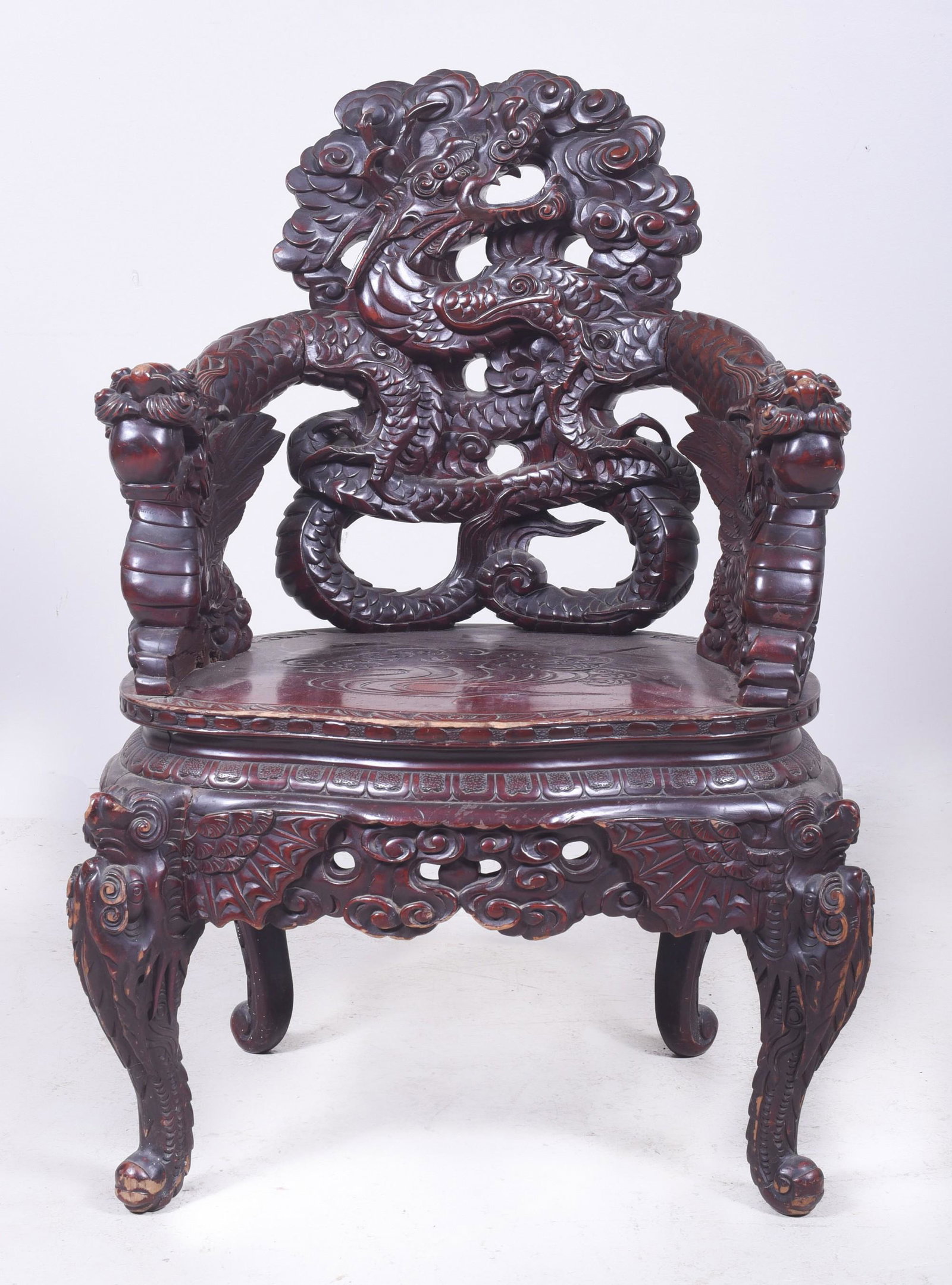 Japanese carved armchair w/ dragons: Japanese carved armchair w/ dragons, carved back with swirling dragon, arms with dragons with balls in mouth, pierced carved skirt, 40"h x 25"w x 20"d