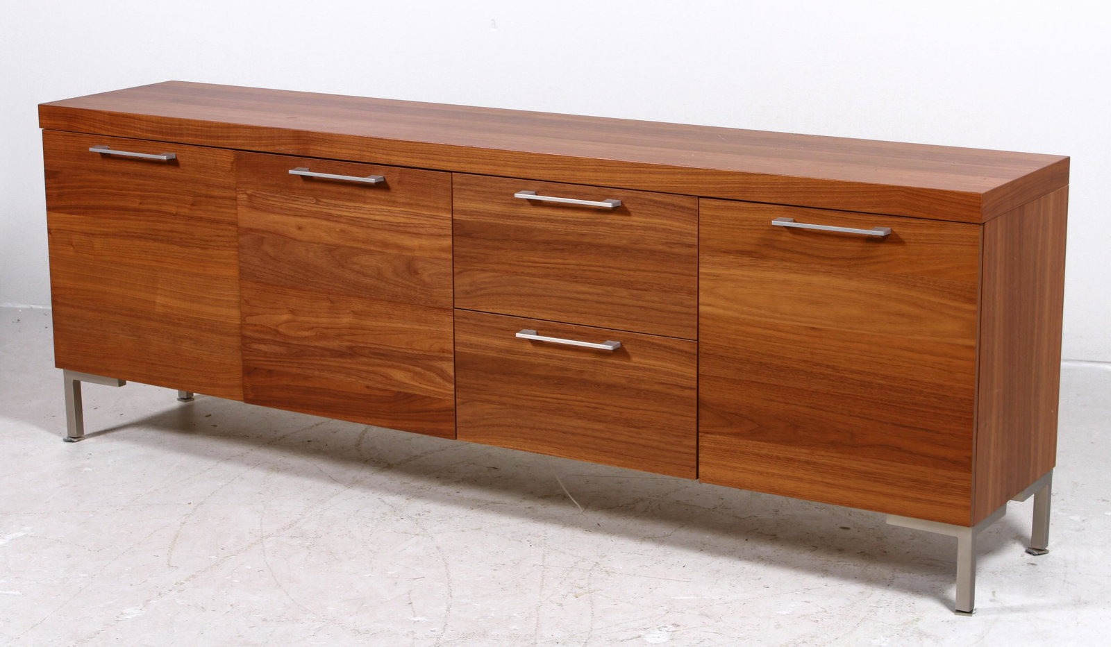 BoConcepts walnut and chrome sideboard: BoConcepts walnut and chrome sideboard, left side with two doors, flanked by two drawers by one door on right end, chrome legs and handles, 29"h x 81"w x 16-1/2"d