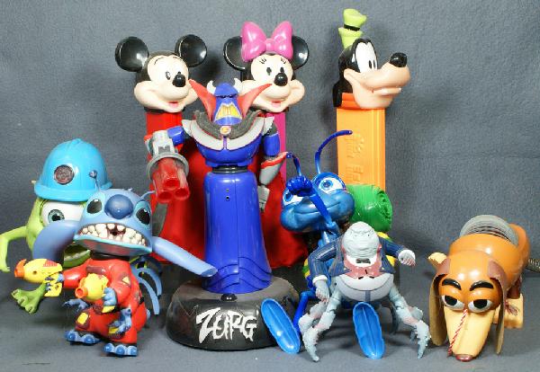 (9) Assorted plastic Disney themed toys including: (9) Assorted plastic Disney themed toys including 3 Pez dispensers