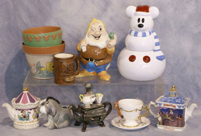 Variety lot of Disney related items including plan: Variety lot of Disney related items including planters, cookie jars, tea cups, tea pots, and a mug