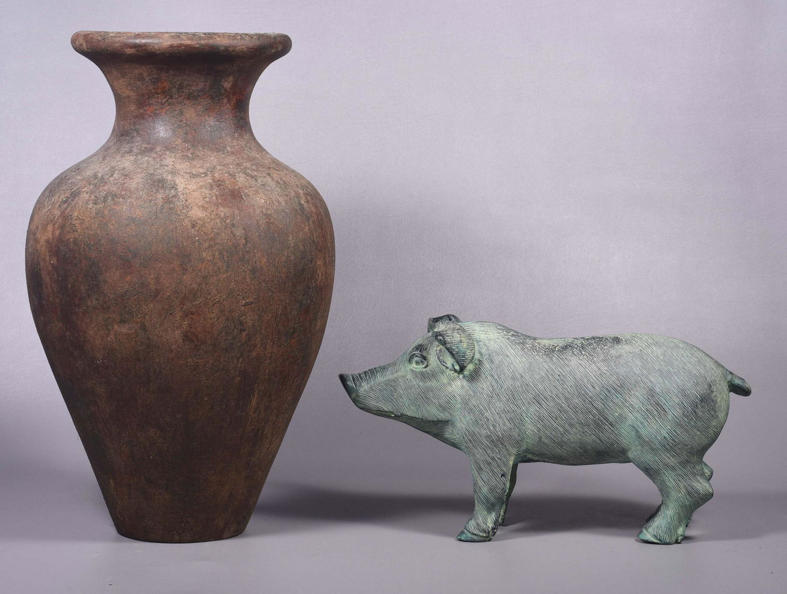 Patinated Pig Form Garden Statue and Vessel: Patinated pig form garden statue and vessel, 20" L snout to tail, 10-1/2" H and redware vessel, 23-1/2" H