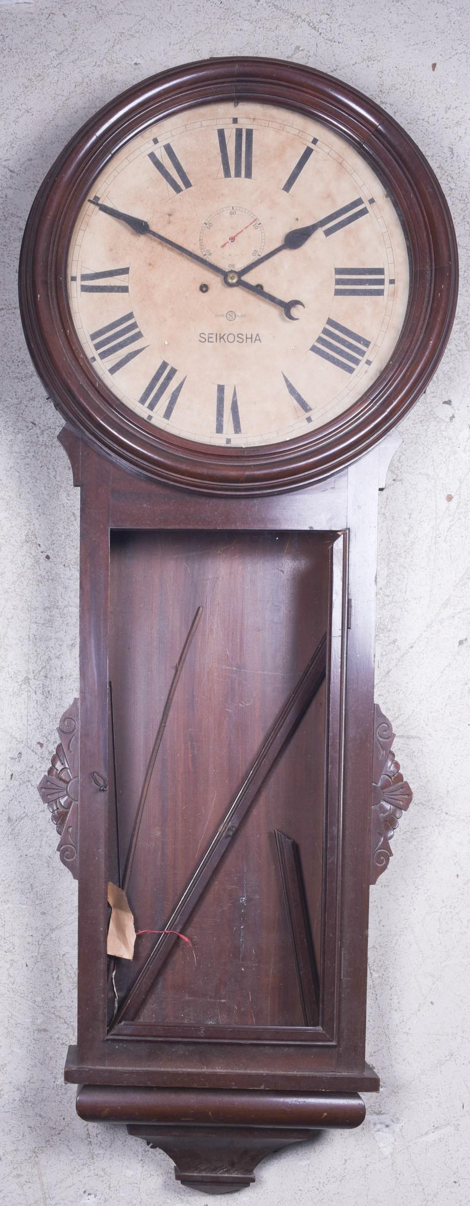 Seikosha Japanese Victorian style wall clock: Seikosha Japanese Victorian style wall clock, 23" dia x 63" h, lacking pendulum bob, door needs to be reattached, lacking glass, no warranty implied or given