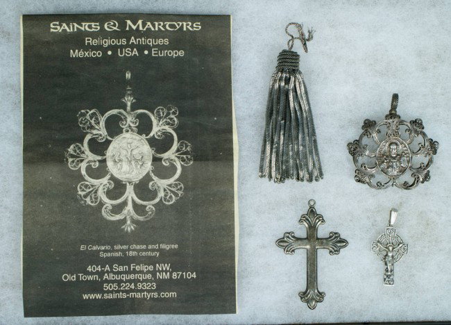 Silver filigree religious medallion depicting a bis: Silver filigree religious medallion depicting a bishop and a saint with an unattached tassel, along with an unmarked silver cross and a sterling crucifix, tallest 2 1/2"