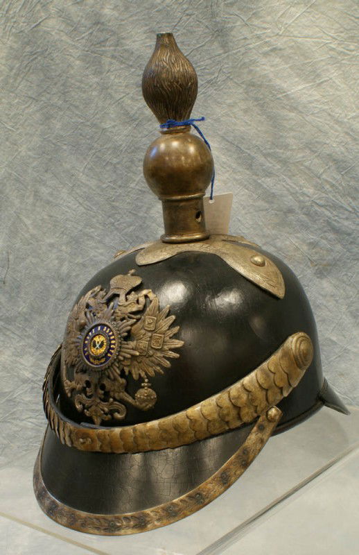Russian Imperial officer, peek helmet hat for Lei: Russian Imperial officer, peek helmet hat for Leib Guard Tsar regiment, double edge on the front ribbon for the order of the St. George on the side. Excellent condition with minor cracks on leather.