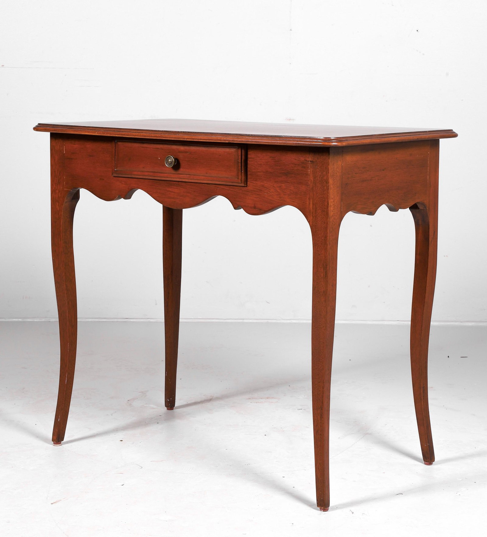 French style mahogany one drawer writing desk: French style mahogany one drawer writing desk, scalloped skirt, 29"h x 34"w x 20"d