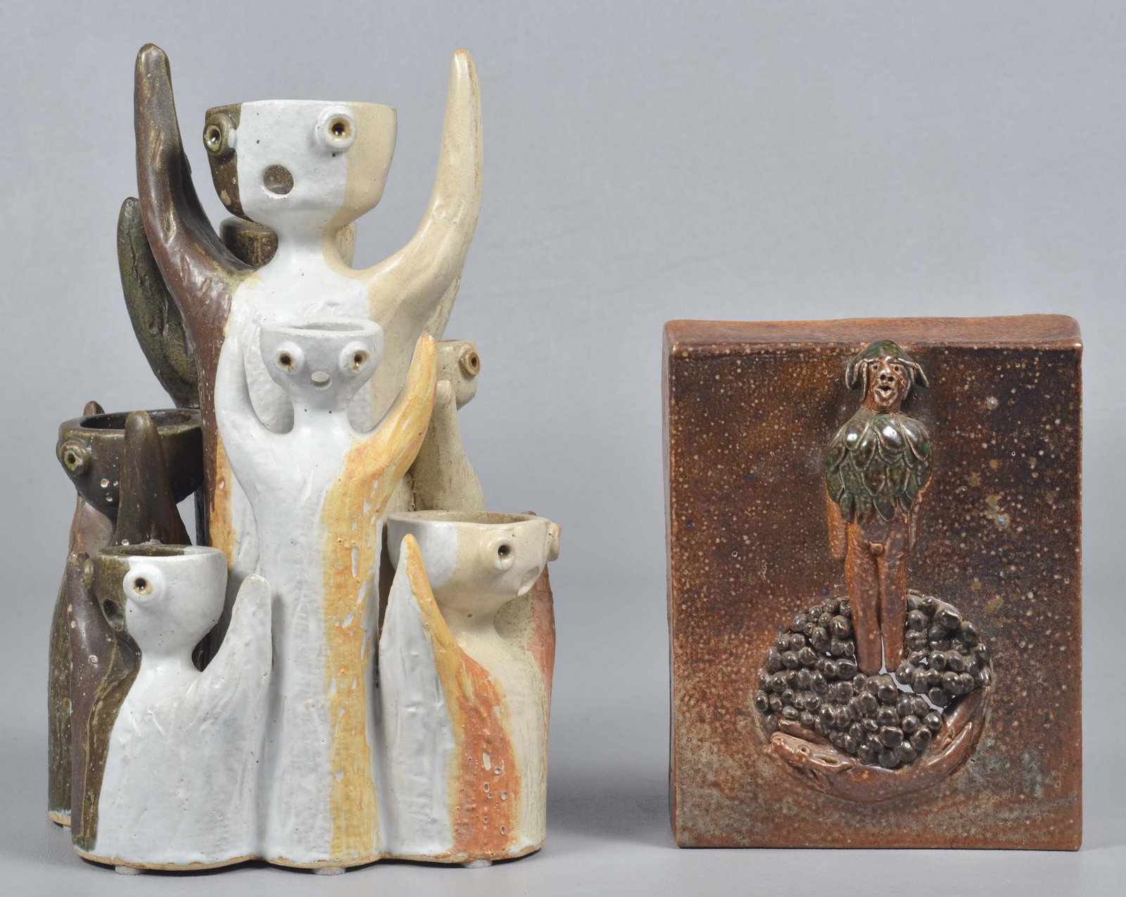 Pottery Wall Plaque and Candelabra: Pottery wall plaque and candelabra to include multi-figure pottery candelabra, depicting various size figures with arms raised, signed illegibly, possible Mietz Kohen, 9-3/4" H, 7-light, and pottery p