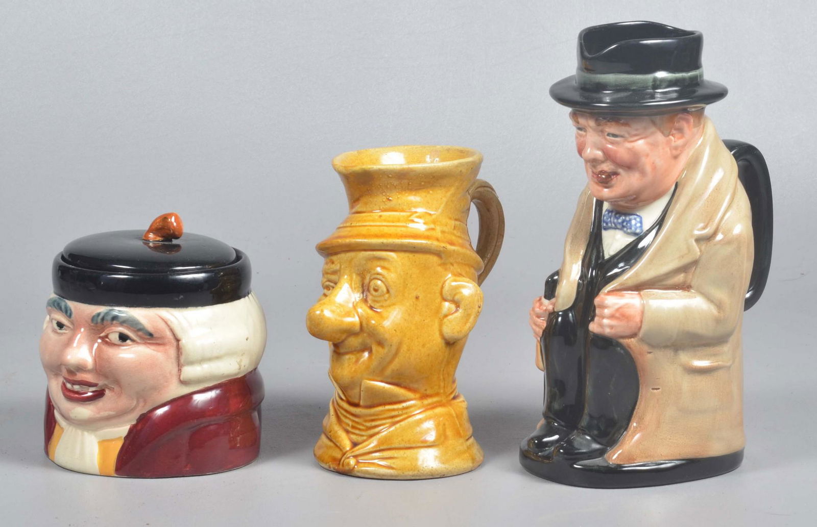 (3) Royal Doulton and Style Jugs and Tobacco Jar: (3) Royal Doulton and style jugs and tobacco jar to include Royal Doulton Winston Churchill large size toby jug, 9" H, Shorter & Sons England 'Barrister' 553 tobacco jar, 4-1/4" H and doulton style wi