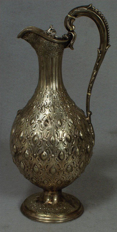 German 800 silver wine ewer, body decorated with et: German 800 silver wine ewer, body decorated with etched c-scrolls and raised medallions, with a foliate cast scroll handle and thumbpiece, raised on a domed foot stamped with crown, half moon and '800