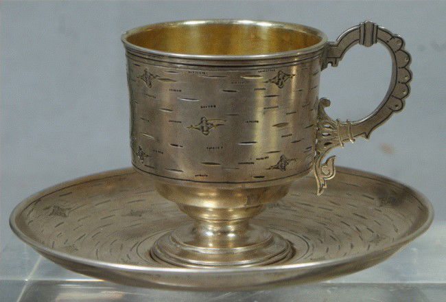 Russian Imperial sterling silver cup and saucer, m: Russian Imperial sterling silver cup and saucer, marked 84 on bases, marked BA and dated 1894, Moscow, Pan Slavic engraved design, cup gilded on interior, 2 3/4" h, plate 5" dia, 5.87 TO
