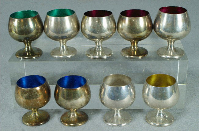 Set of (9) Gorham sterling silver enameled liquor : Set of (9) Gorham sterling silver enameled liquor cups, 1 yellow, 2 green, 3 magenta, 2 blue and 1 plain, retailed by Caldwell, tallest measures 2" h, 5.84 TO