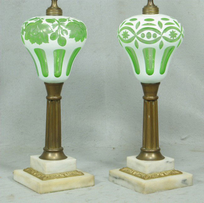 Pr cased glass white cut to light green kerosene: Pr cased glass white cut to light green kerosene lamps with brass & marble bases, 14 3/4" tall to top of burner fitter, white silk shades, 27" tall overall