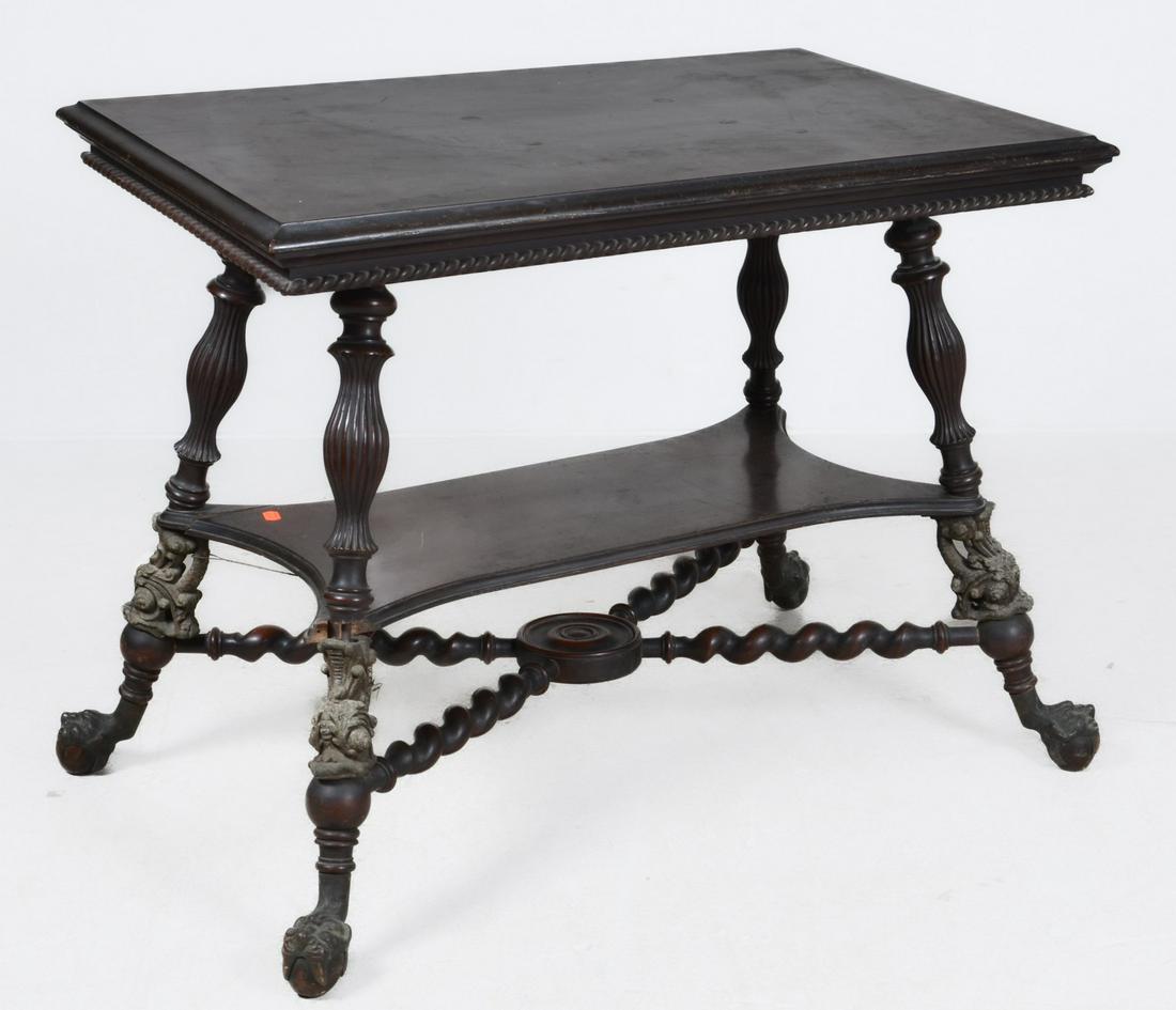 A Renaissance Revival style carved mahogany two tier center table (1 of 7)