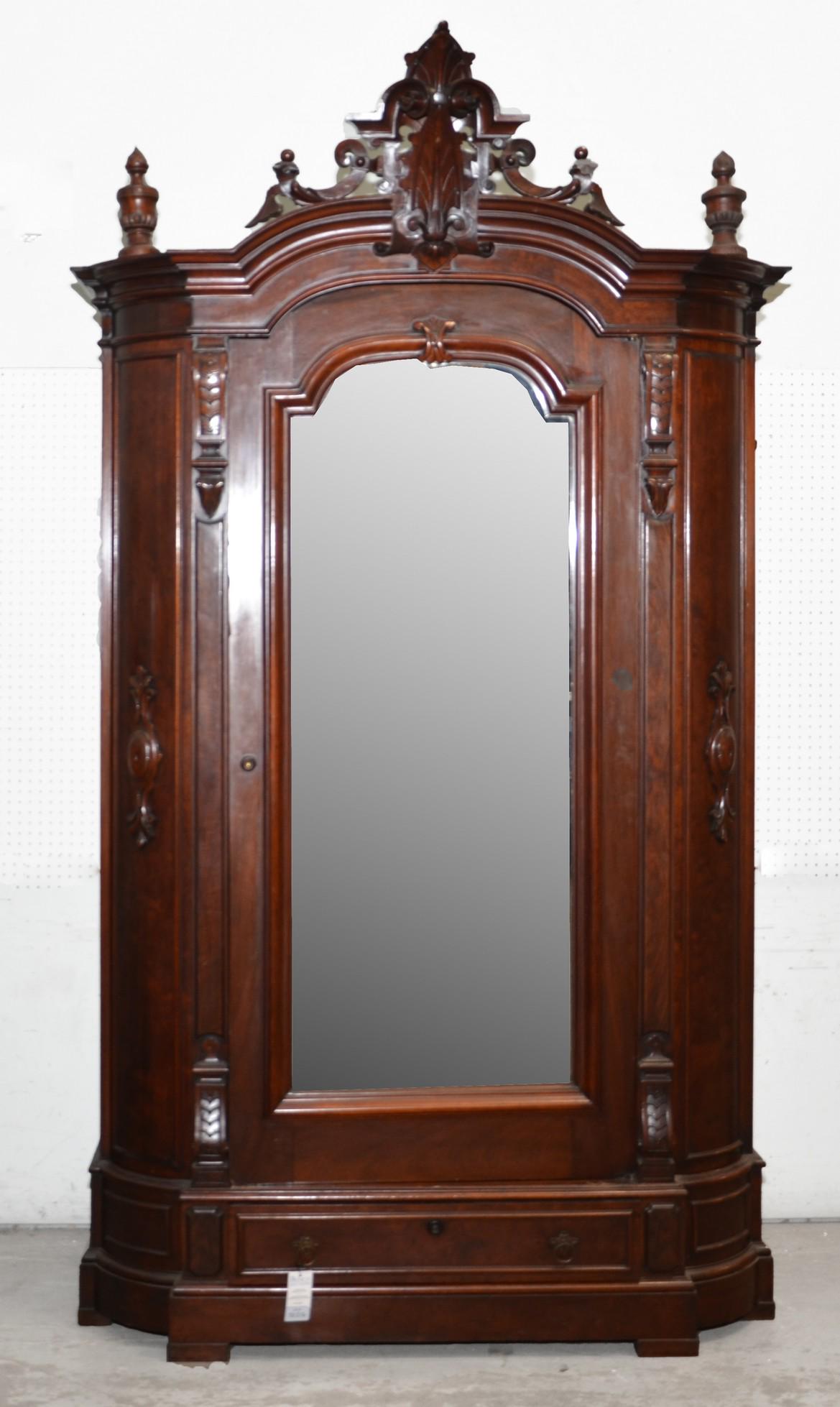 A Renaissance Revival carved rosewood armoire (1 of 3)