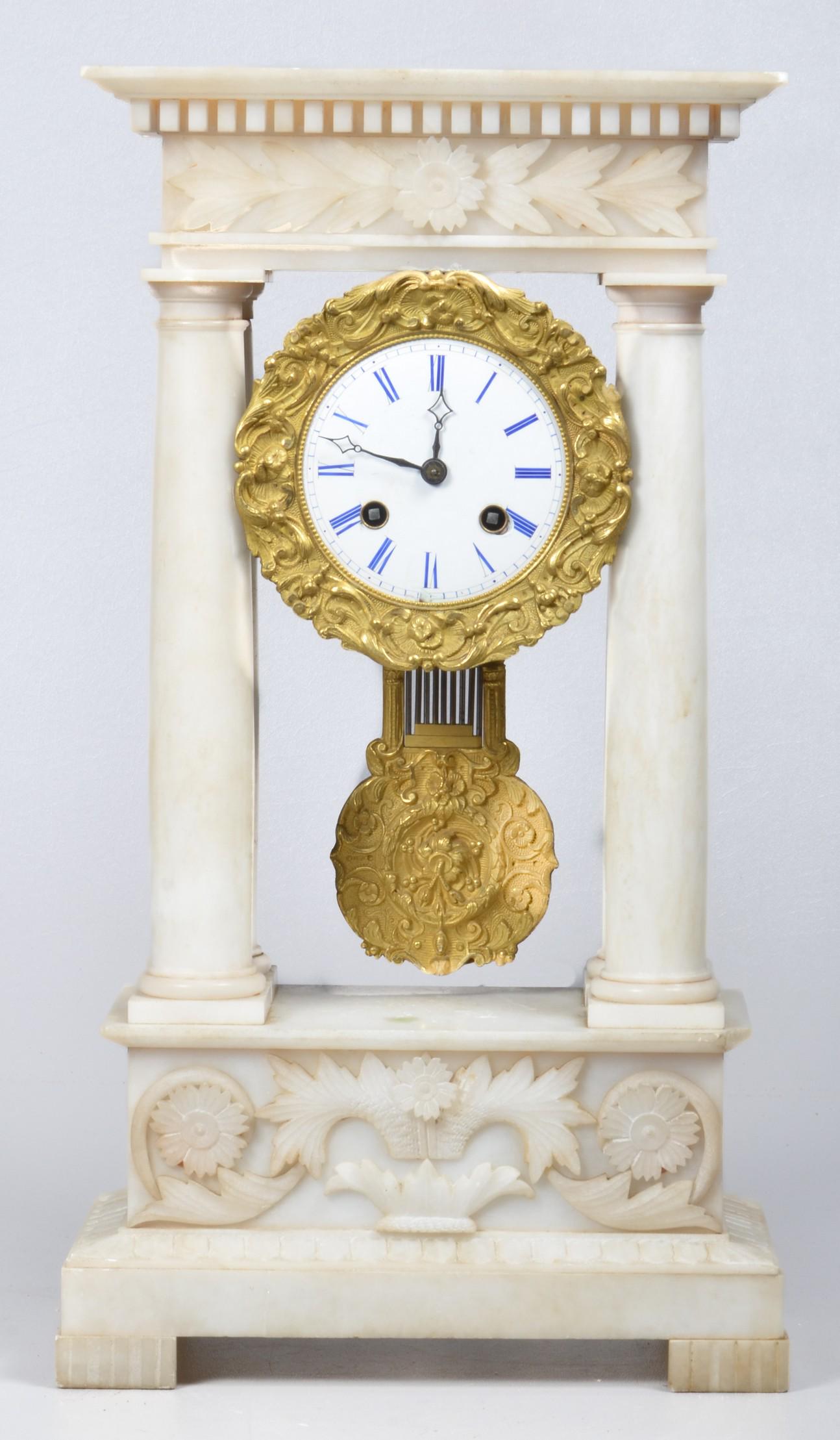Alabaster Portico Clock: Alabaster portico clock, porcelain dial blue enamel numerals, floral & carved leaf design, dental molding, urn with floral rosettes & leaves, 16-1/2" x 9" x 5", corner below right front column chipped